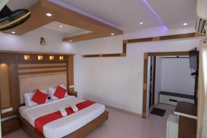 Кровать или кровати в номере Chilanka Lake view Resort