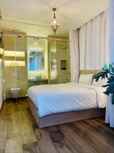 Postel nebo postele na pokoji v ubytování Aparthotel & Hotel Doha