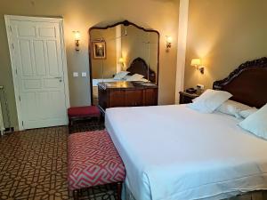 Posteľ alebo postele v izbe v ubytovaní Hotel Simon