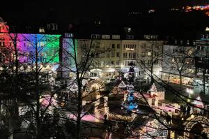 a view of a city at night with lights at Appartement-Koblenz in Koblenz