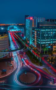 a busy city street at night with cars at Ibis One Central - World Trade Centre Dubai in Dubai