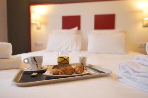 Letto o letti in una camera di Hôtel du Musée