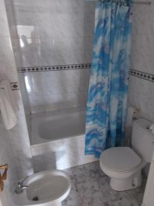 a bathroom with a toilet and a sink and a shower at Fuensanta 400m to Beach Med Syndicate 10 in Torrevieja