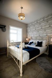 Postel nebo postele na pokoji v ubytování Cannon Cottage
