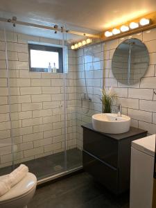 a bathroom with a sink and a shower at Ktima Papadimitriou in Ioannina +49 photos