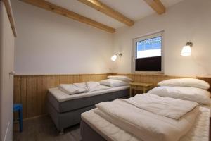 Postel nebo postele na pokoji v ubytování Haus Elisabeth Bootshaus