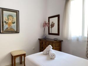 Łóżko lub łóżka w pokoju w obiekcie Penthouse Clavero Casasol