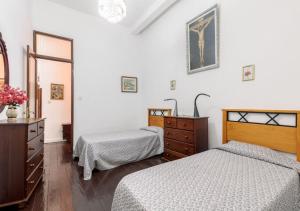 A bed or beds in a room at Casa Clásica en Santa Cruz Palma