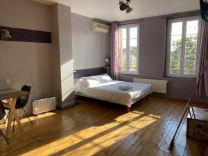 מיטה או מיטות בחדר ב-Relais des Iles chambres d'hôtes
