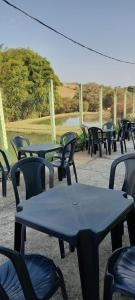 a group of tables and chairs sitting under a tent at Boa Vista in São Thomé das Letras