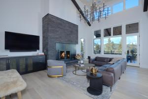 a living room with a couch and a fireplace at Inspiration Point Townhome 1B in Big Sky