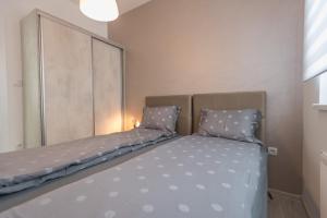 Ένα ή περισσότερα κρεβάτια σε δωμάτιο στο Apartment Ekatarina