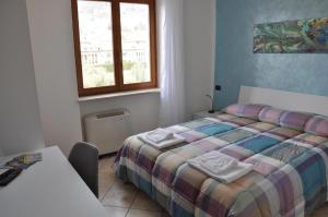 Postel nebo postele na pokoji v ubytování Borgo Piccolo