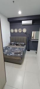 Ένα ή περισσότερα κρεβάτια σε δωμάτιο στο My Exclusive StayCation, Metrocity