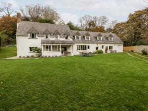 a large white house with a large yard at The Studio - Arne in Wareham