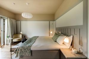 Säng eller sängar i ett rum på Villa Baro