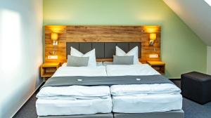 Postel nebo postele na pokoji v ubytování City-Hotel-Wolgast