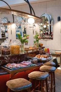 a kitchen filled with lots of different types of food at Hotel Bachaumont in Paris