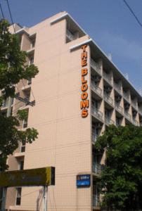 a building with a hotel sign on the side of it at The Blooms Residence in Bangkok