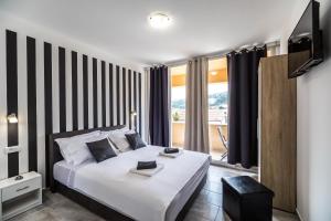 Postel nebo postele na pokoji v ubytování Apartments Sunshine Home