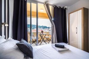 Postel nebo postele na pokoji v ubytování Apartments Sunshine Home
