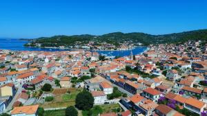 an aerial view of a town next to the water at Apartments Sunshine Home in Vela Luka