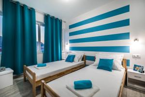 Postel nebo postele na pokoji v ubytování Apartments Sunshine Home