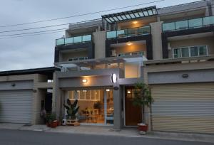 a large building with a clock in front of it at Xiaodou B&B in Taitung City