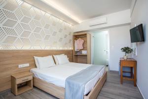 Postel nebo postele na pokoji v ubytování Tsampika Hotel Faliraki + 37 fotografií