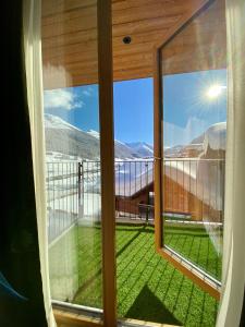 a view from a window of a mountain view at Livì Family Hotel in Livigno