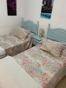 מיטה או מיטות בחדר ב-Manzanares