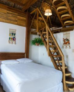 Postel nebo postele na pokoji v ubytování Xcabal Hotel boutique