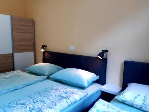 Postel nebo postele na pokoji v ubytování SočaLand Apartmaji