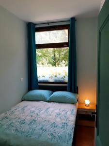 Postel nebo postele na pokoji v ubytování SočaLand Apartmaji