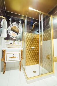 a bathroom with a shower and a sink at Royal Plaza Hotel in Tbilisi City