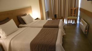 Voodi või voodid majutusasutuse Hotel Xanthippion toas