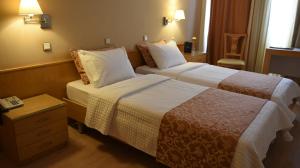 Voodi või voodid majutusasutuse Hotel Xanthippion toas