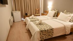 Ένα ή περισσότερα κρεβάτια σε δωμάτιο στο Ξενοδοχείο Ξανθίππειον