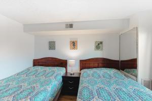 Postel nebo postele na pokoji v ubytování Jamaica Bay 105A + 11 fotografií