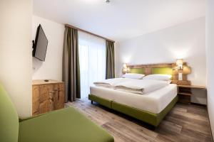 Ένα ή περισσότερα κρεβάτια σε δωμάτιο στο Der Alpenblick