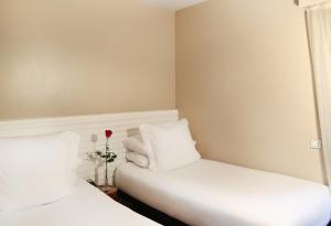 Hotel Gran Derby Suites, a Small Luxury Hotel of the World客房内的一张或多张床位