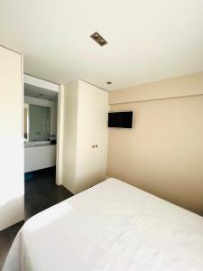 A bed or beds in a room at Apartamento de Lujo Benicasim - Primera Línea