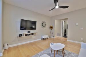 A television and/or entertainment centre at *New* XquisiteMidCenturyM0d~ Condo *OTR* w/Parking