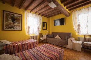 Postel nebo postele na pokoji v ubytování La Fossetta B&B