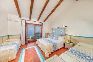 Postel nebo postele na pokoji v ubytování Il Borgo BagaBaga - Exclusive Country Retreat