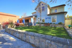 a house with a stone retaining wall in the yard at 18th Street C in Boise