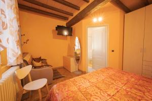 Postel nebo postele na pokoji v ubytování La Fossetta B&B
