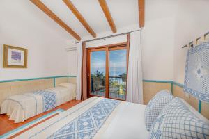 Postel nebo postele na pokoji v ubytování Il Borgo BagaBaga - Exclusive Country Retreat