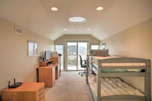 a room with two bunk beds and a desk at Secluded Home with Pool about 14 Mi to Coeur dAlene! in Post Falls +35 photos