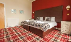 A bed or beds in a room at SGE Esplanade Hotel